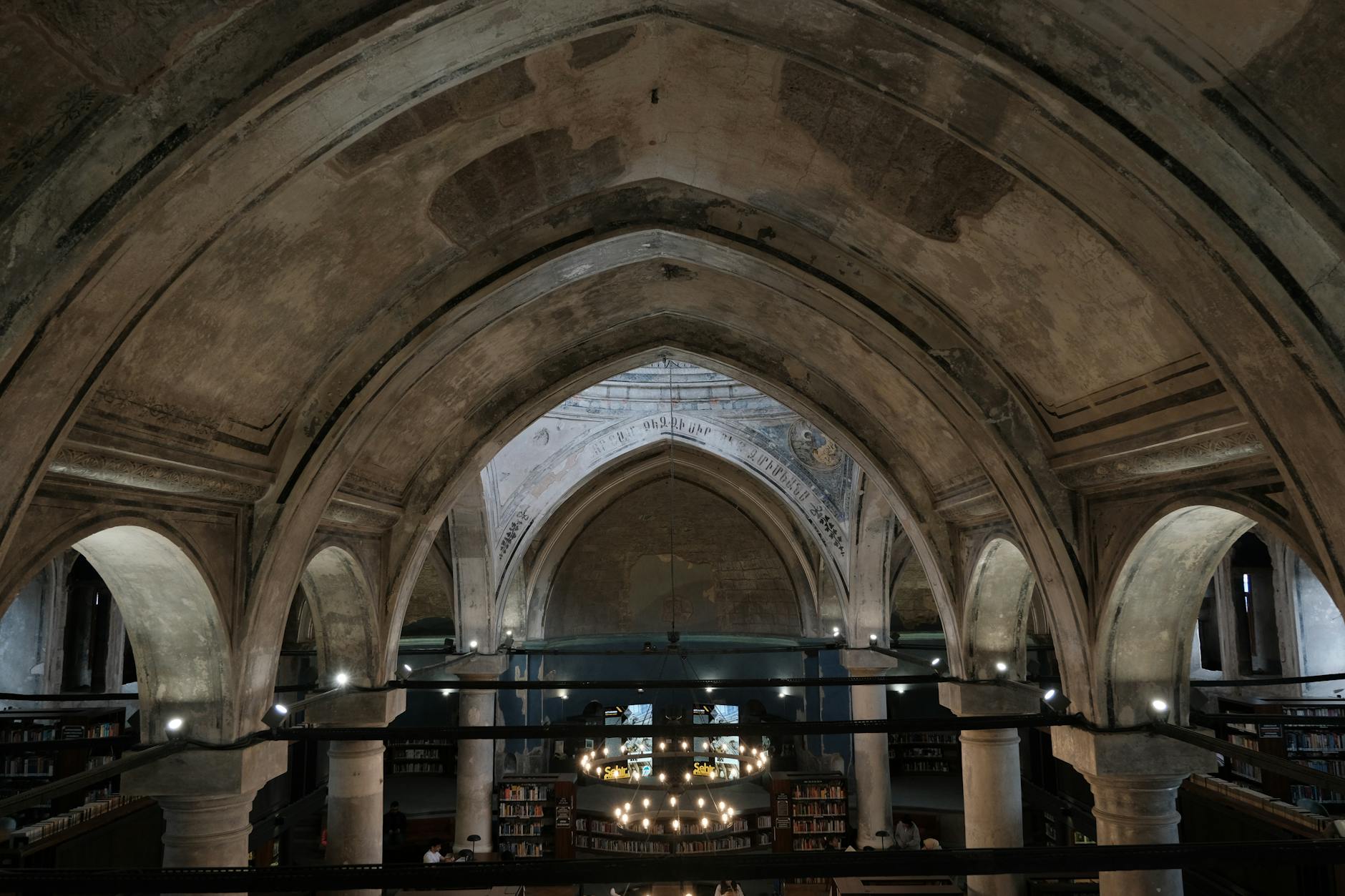 Gothic arches inside Manchester museums cultural venue showcasing architectural heritage