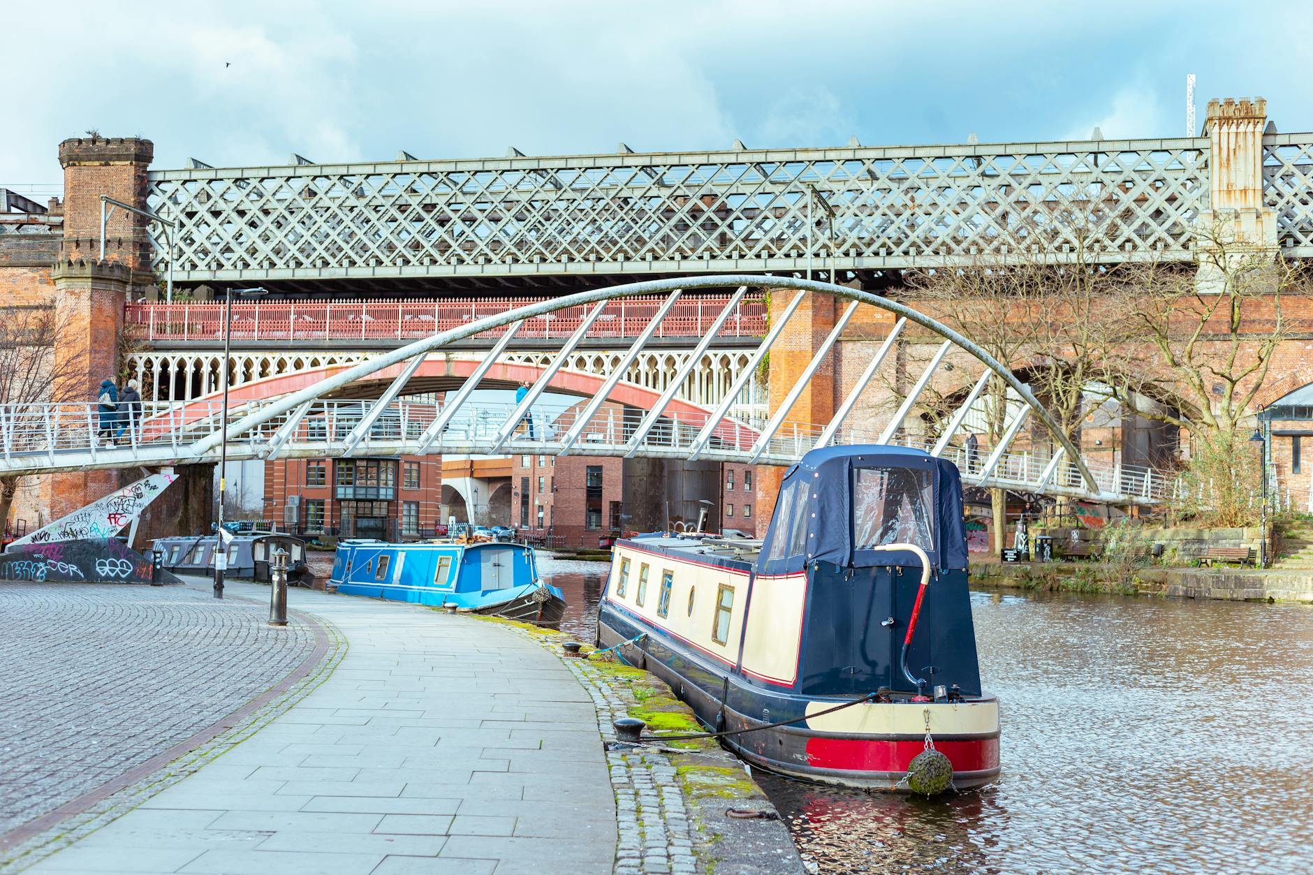 Peaceful canal waterfront with boats in Manchester Castlefield area
