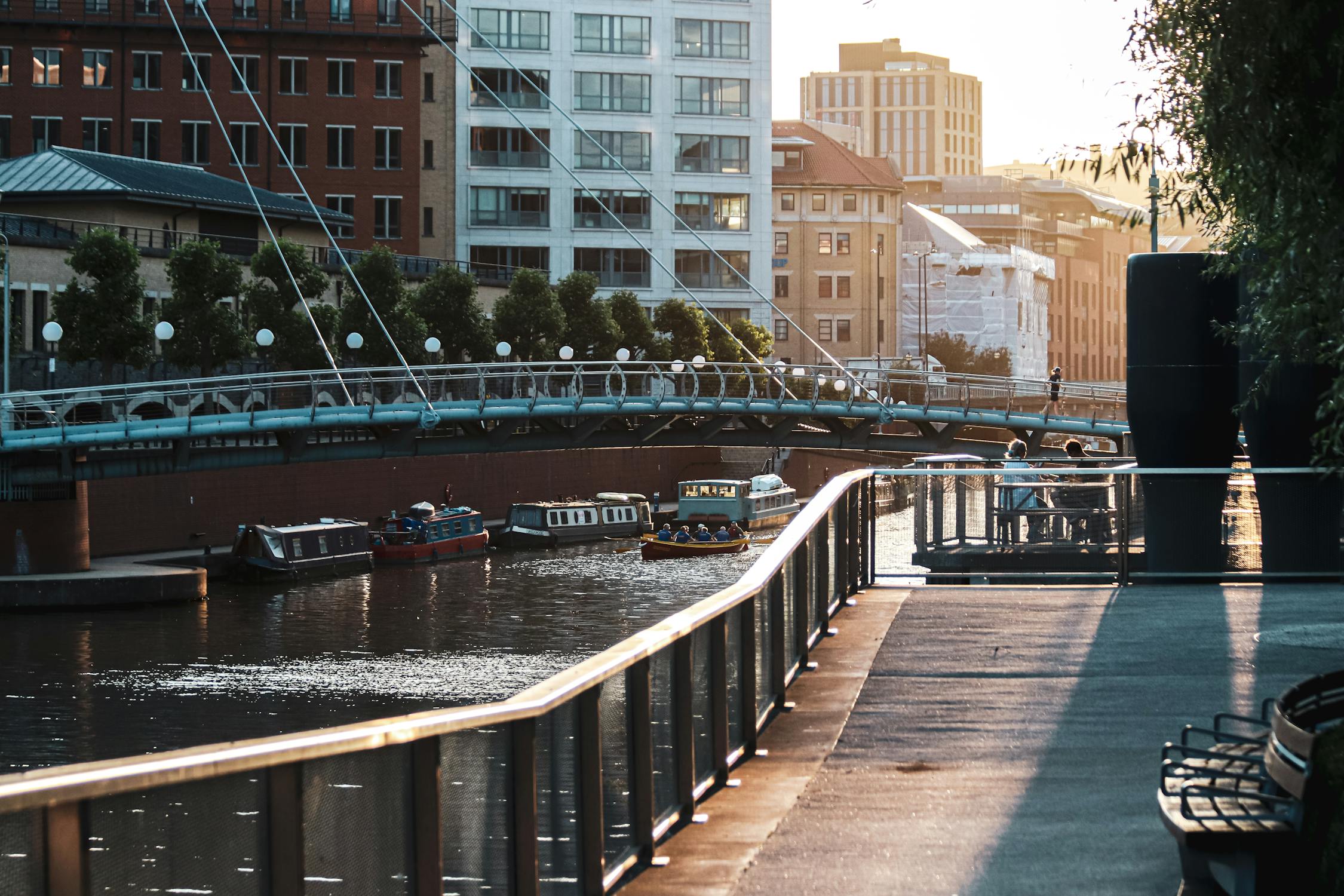 The Ultimate Guide to Things to Do in Manchester (2026) 5 Sunset view of a canal with boats and a bridge in Manchester Castlefield area