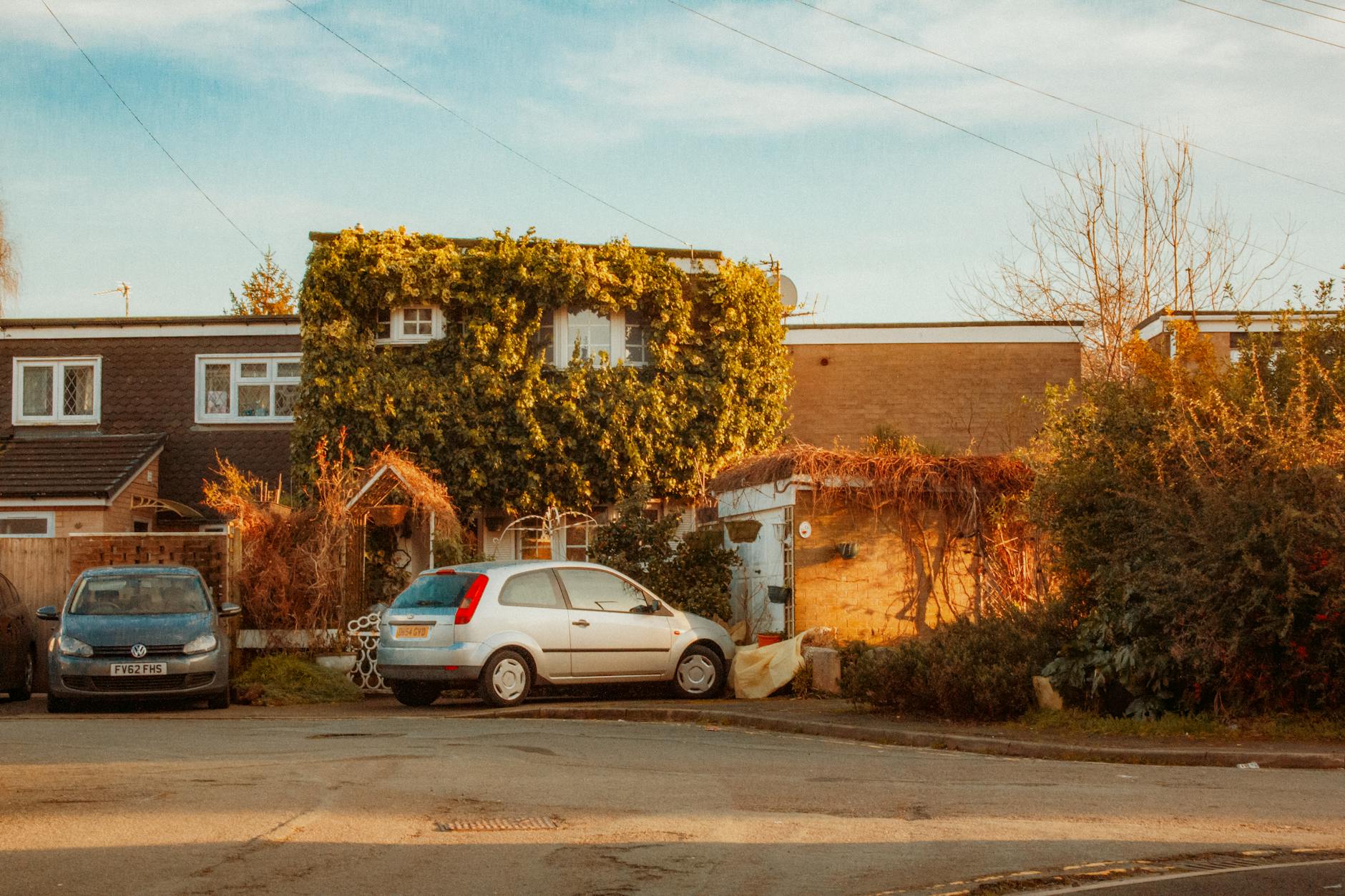 Leafy suburban village street with charming houses typical of South Manchester