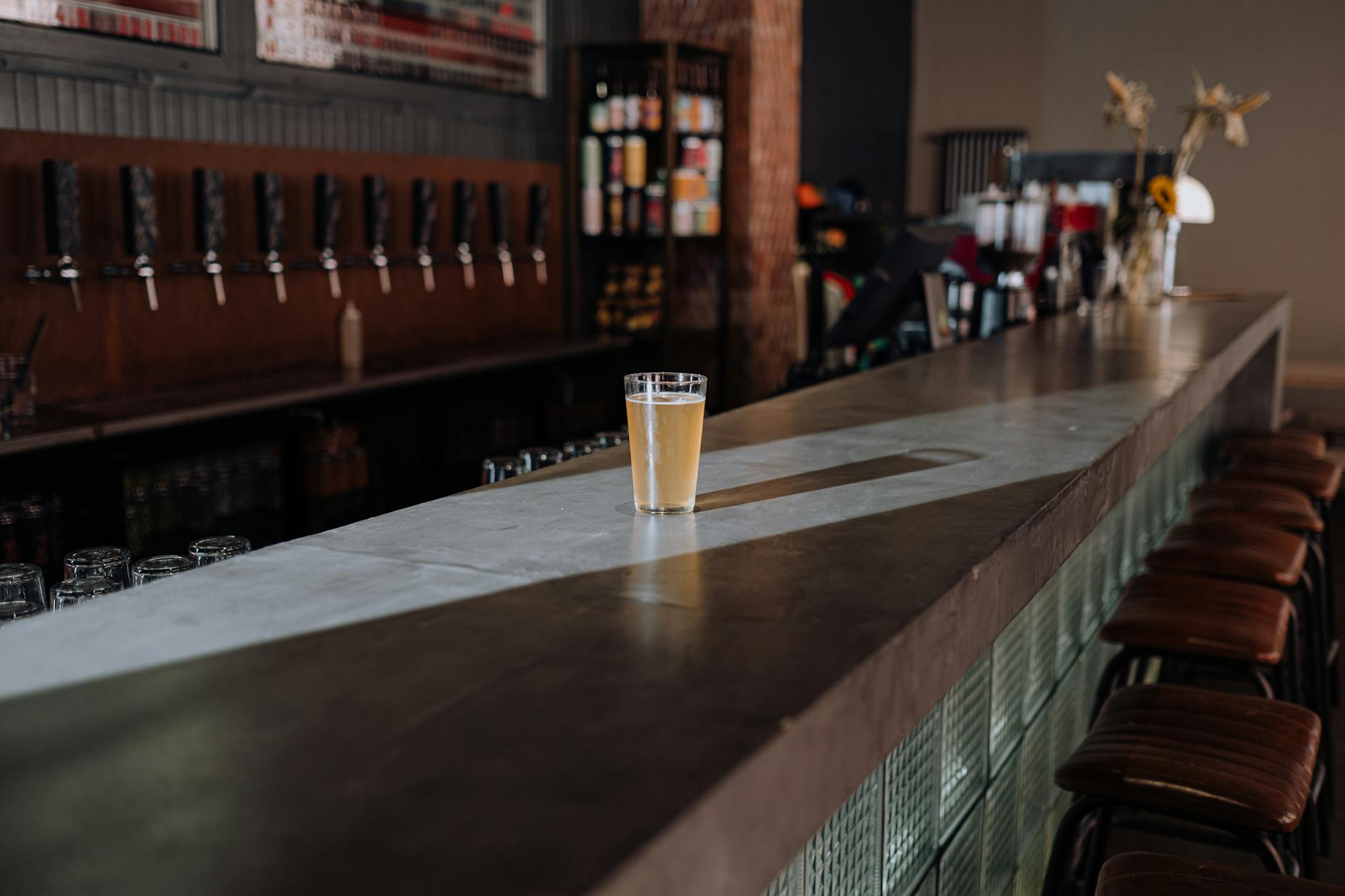 Cosy traditional pub interior with craft beer on tap in Manchester