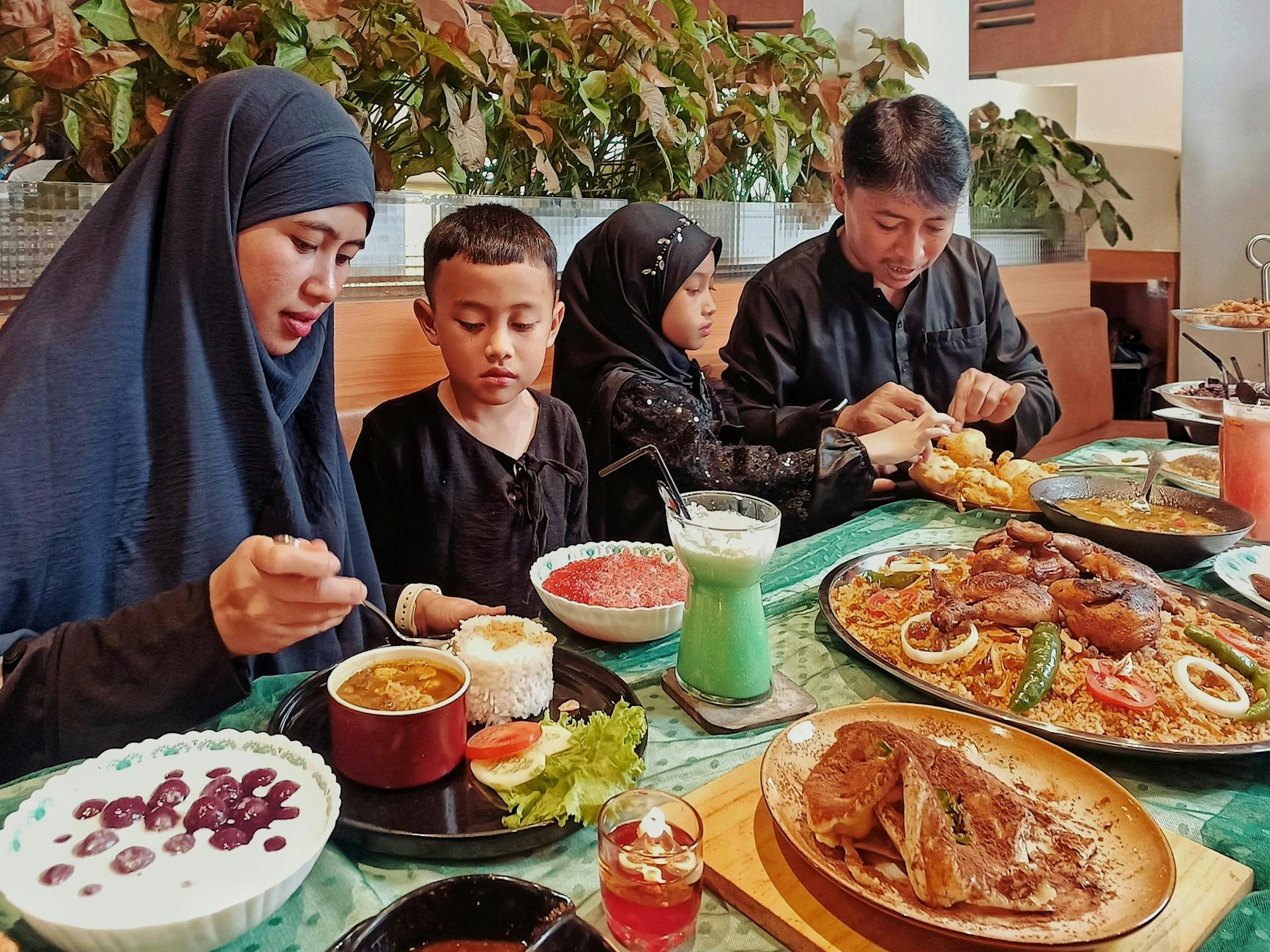 Manchester for Families: The Complete Kids & Family Guide 8 Family enjoying a meal together at a restaurant