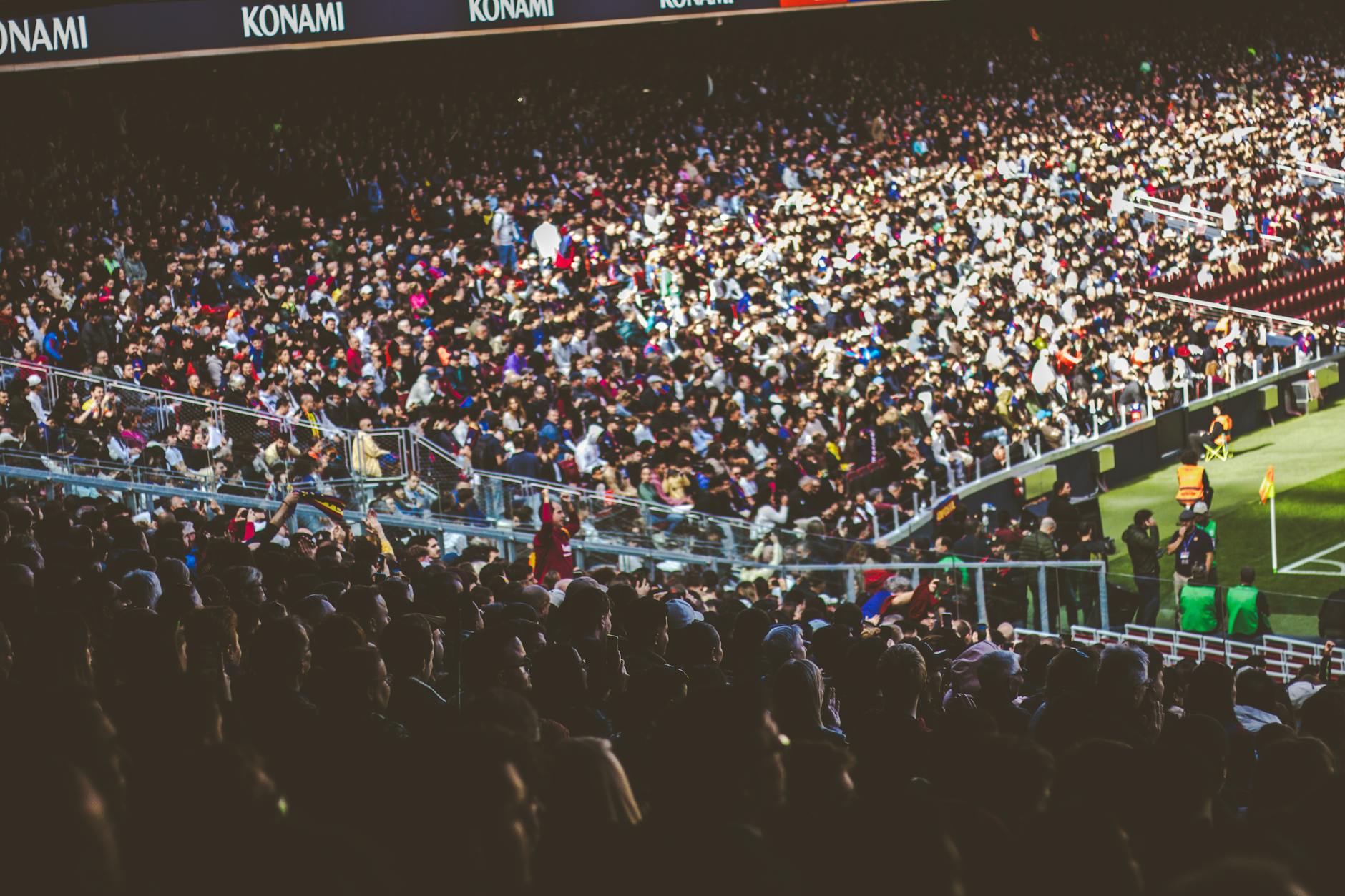 Sports fans celebrating at a Manchester stadium — Manchester football tourism at its best
