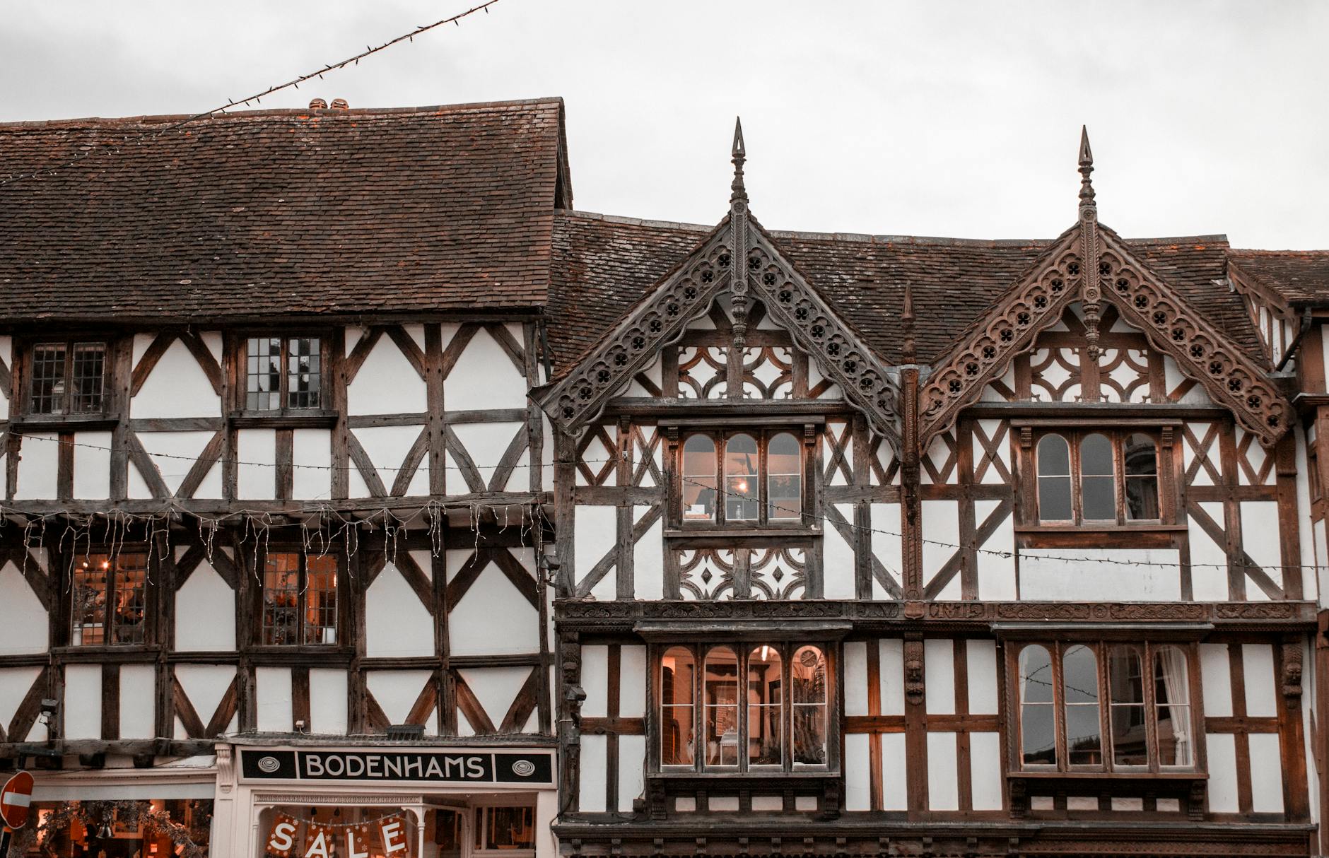 Chester Day Trip from Manchester: The Complete 2026 Guide (Walls, Rows, Zoo & Roman Heritage) 3 Chester Rows medieval two-tier shopping galleries Tudor buildings UK
