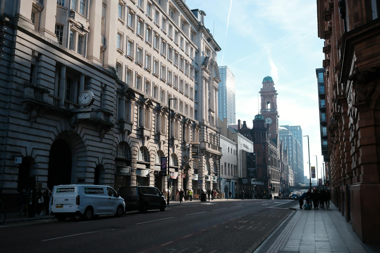 Pedestrians walking through Manchester city centre