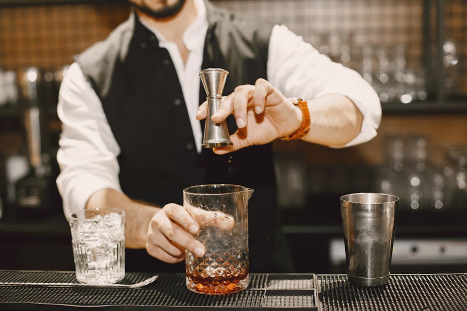 Best Cocktail Bars in Manchester: Speakeasy & Rooftop Guide (2026) 6 Manchester bartender cocktail mixing