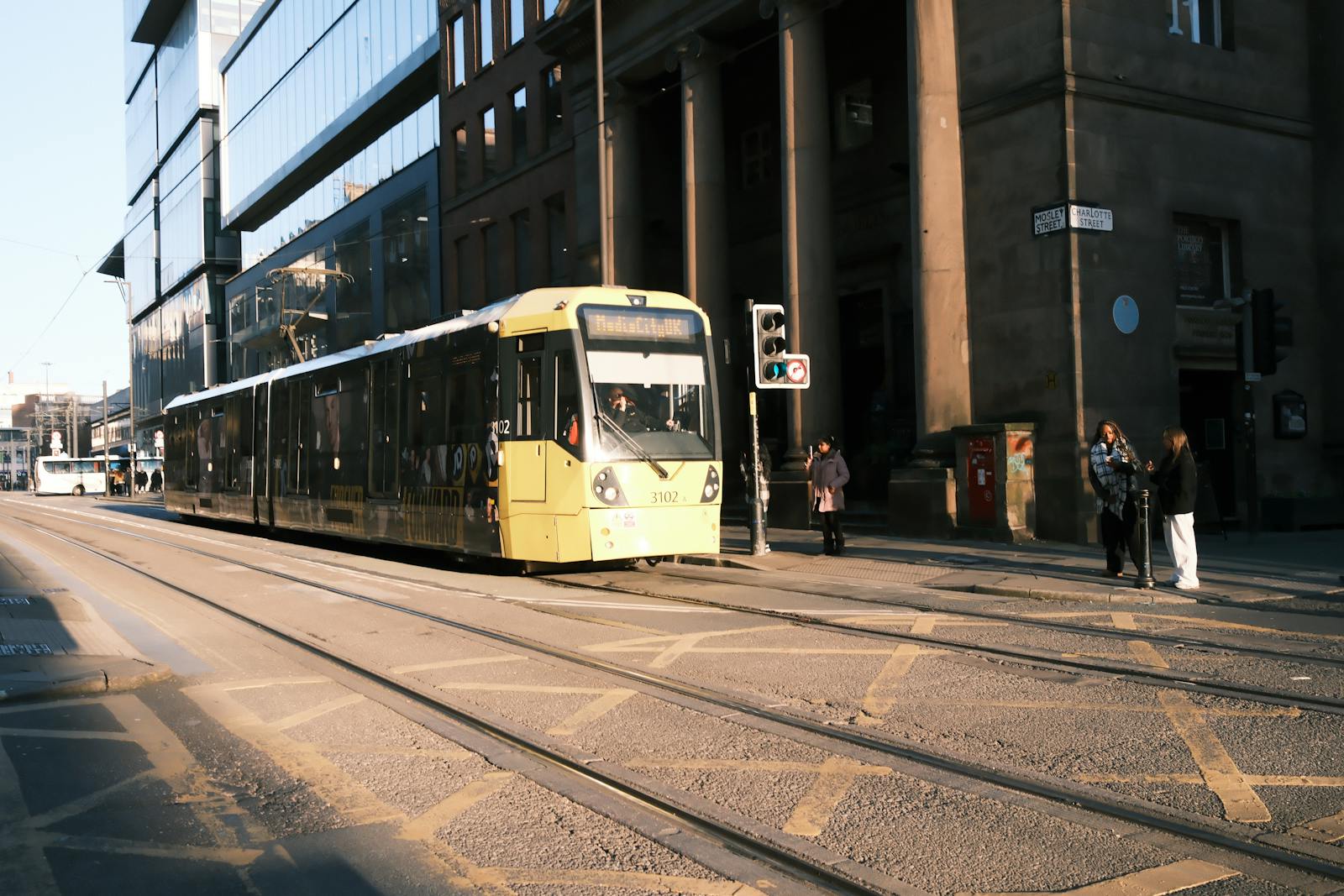 Manchester Metrolink Tram Guide for Visitors (2026) 3 Metrolink tram passing through St Peter's Square Manchester