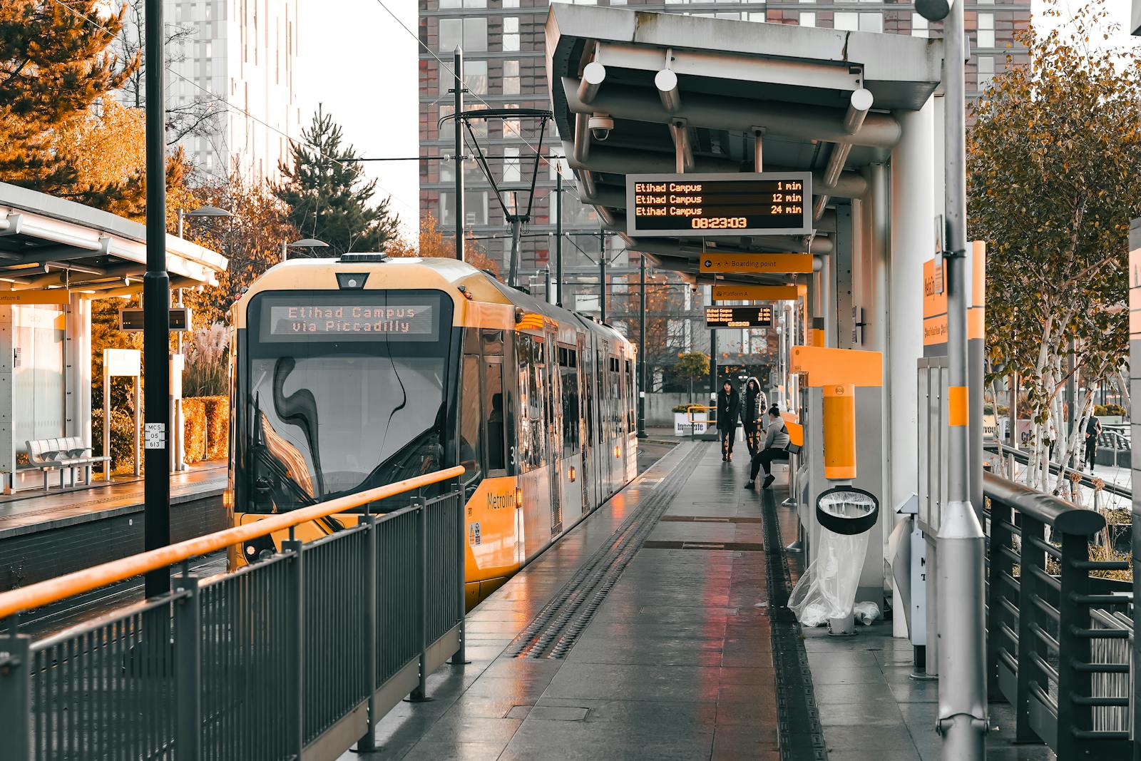 Manchester Metrolink tram at a city centre stop