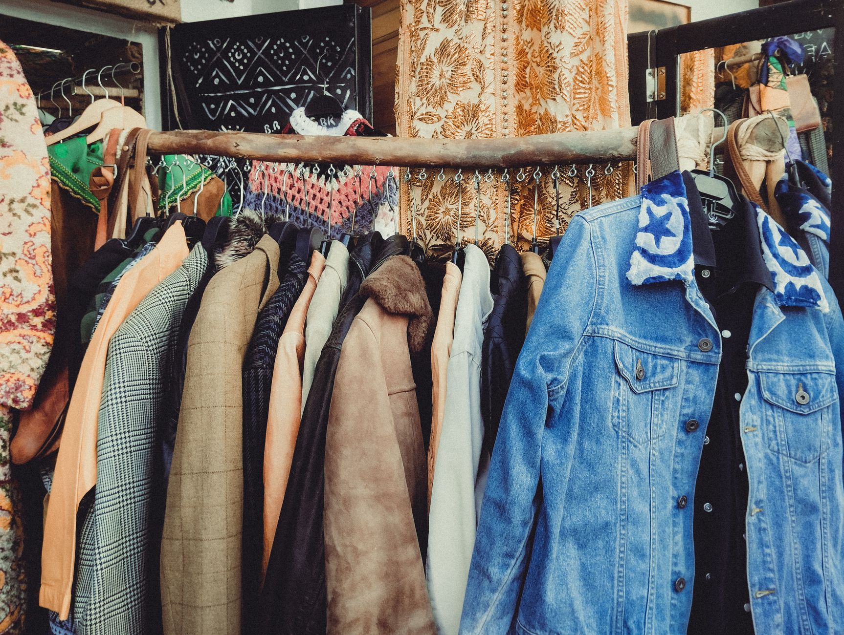 Best Vintage & Charity Shops in Manchester (2026 Guide) 2 Manchester vintage clothing shop rail Northern Quarter retro fashion