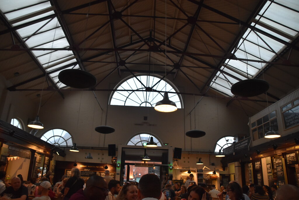 Greater Manchester Towns: The Complete Guide Beyond the City Centre 3 Diners at shared tables under the glazed roof of Market House food hall in Altrincham