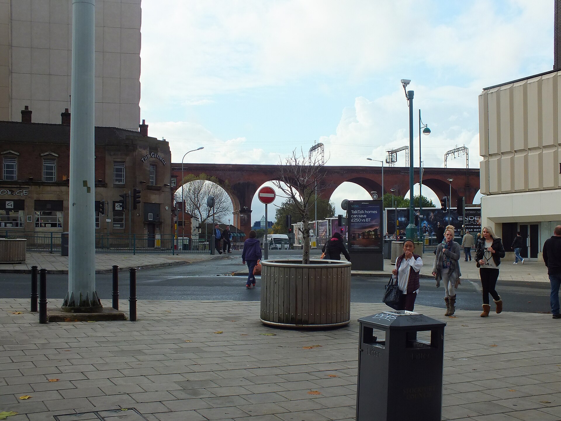 Greater Manchester Towns: The Complete Guide Beyond the City Centre 2 The brick arches of Stockport railway viaduct behind a pedestrianised street in the town centre