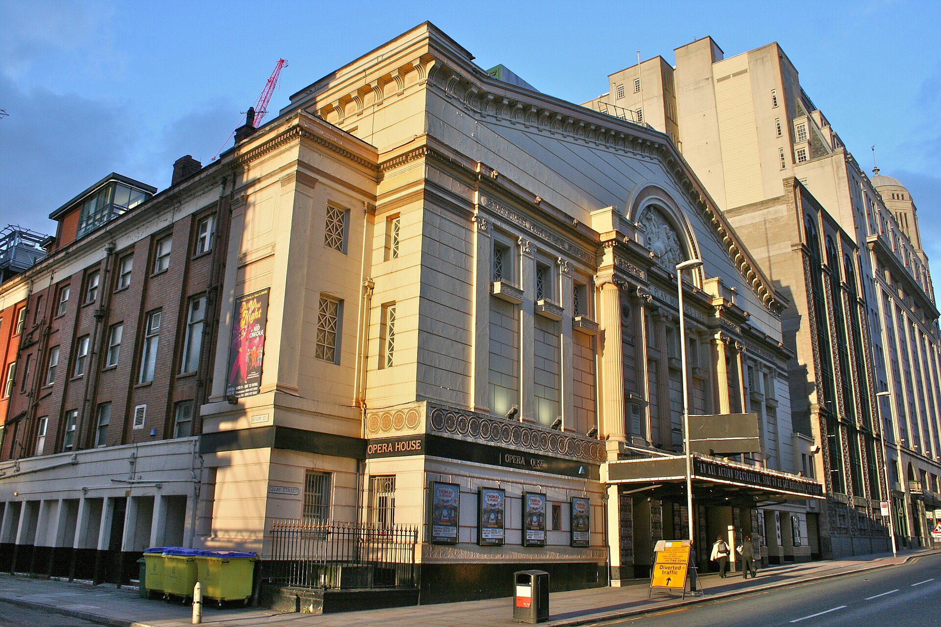 Manchester in November: Weather, Events & What to Do 7 The classical facade of the Manchester Opera House on Quay Street in evening sunlight