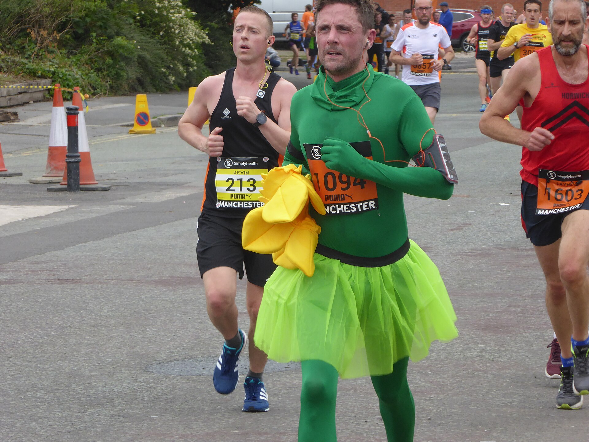 Manchester Marathon & Great Manchester Run: Runner & Spectator Guide 5 Runners on the Great Manchester Run, one in a green costume and tutu