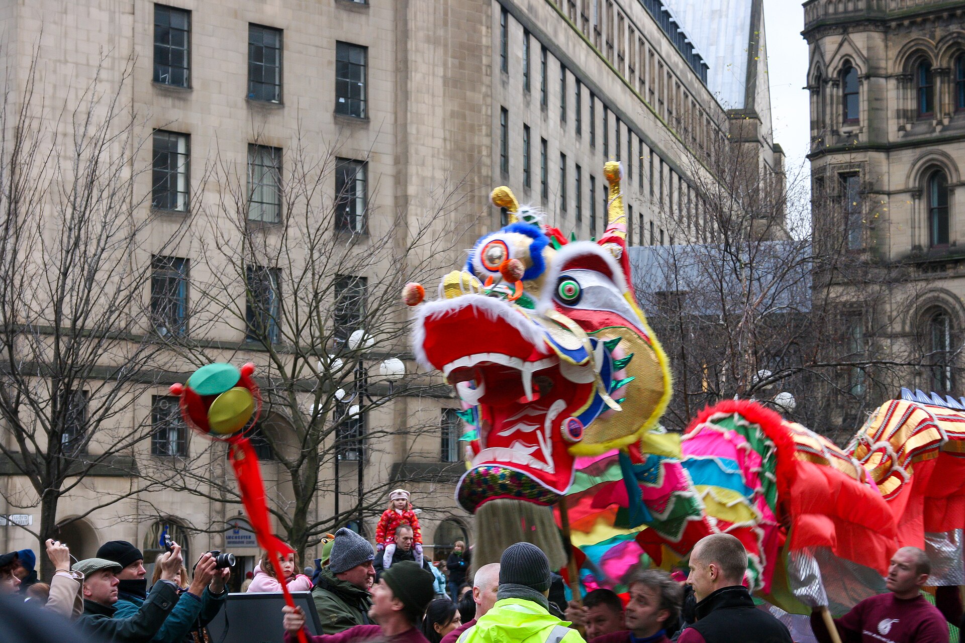 Manchester Month by Month: The Year-Round Visitor's Calendar 2 A colourful Chinese dragon carried through crowds in Manchester city centre during Chinese New Year