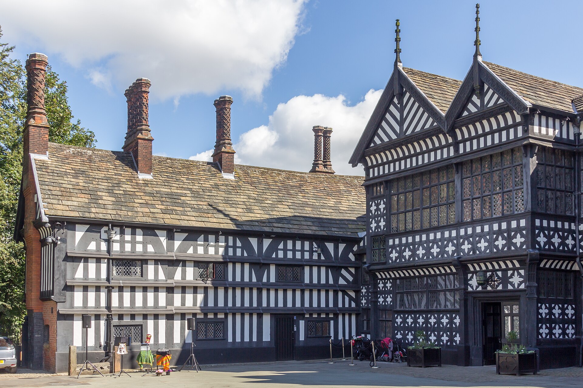 Stockport: Things to Do in Manchester's Comeback Town 6 The black-and-white timber-framed Tudor front of Bramall Hall under a blue sky
