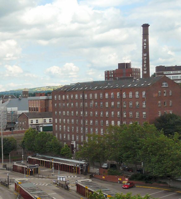 Stockport: Things to Do in Manchester's Comeback Town 4 Wellington Mill in Stockport, a large brick mill, with a tall chimney lettered Hat Museum