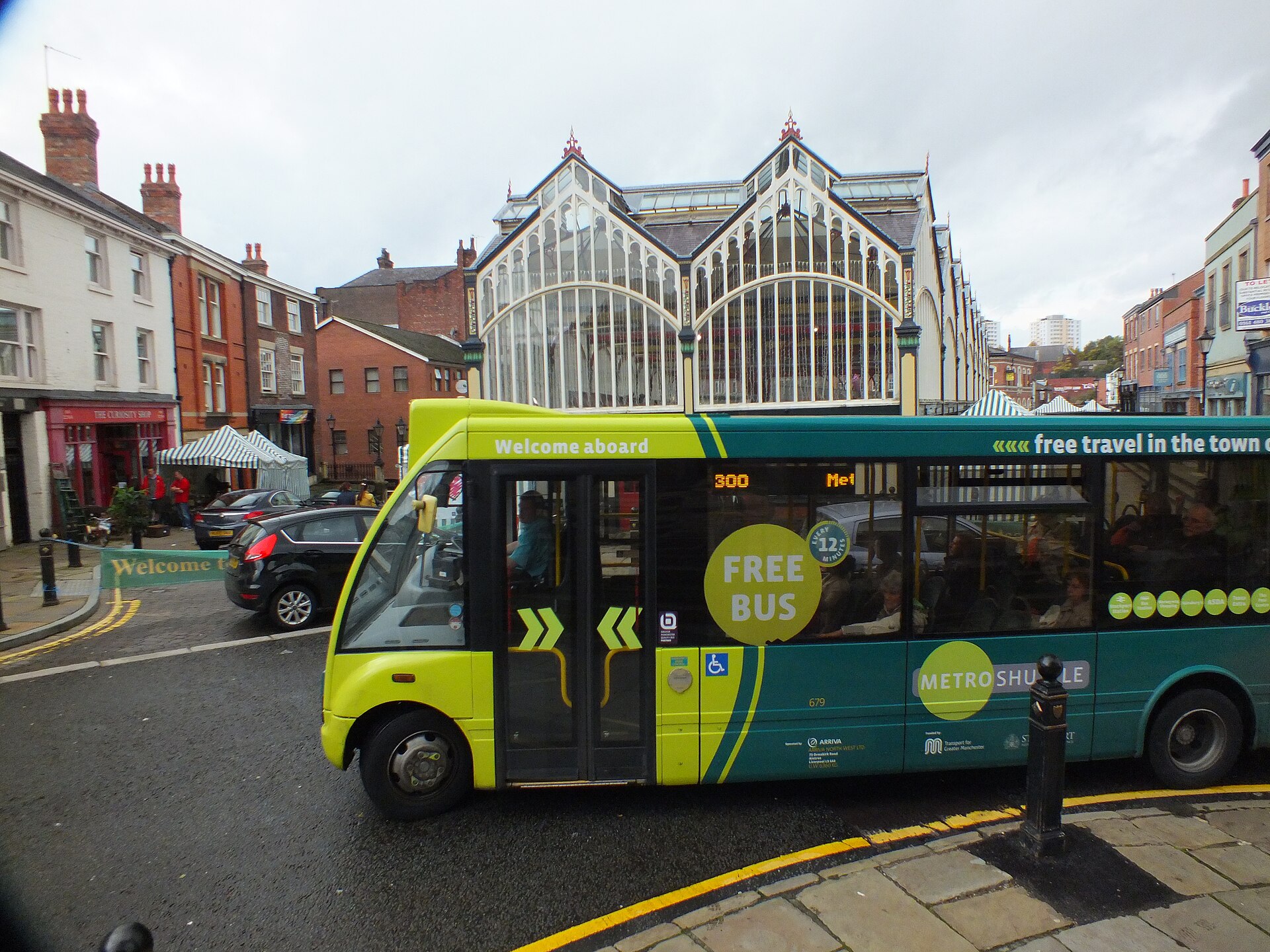 Stockport: Things to Do in Manchester's Comeback Town 3 The glass-roofed Victorian Market Hall in Stockport's Market Place, with a bus in front