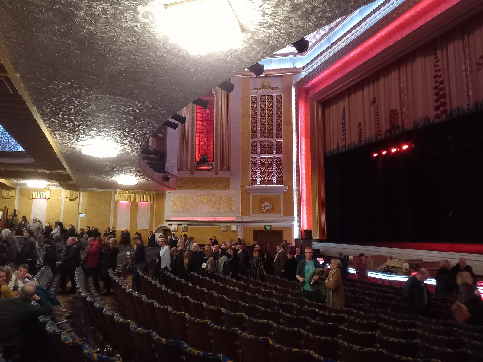 Stockport: Things to Do in Manchester's Comeback Town 7 The Art Deco auditorium of the Stockport Plaza with an audience seated before the red-lit stage