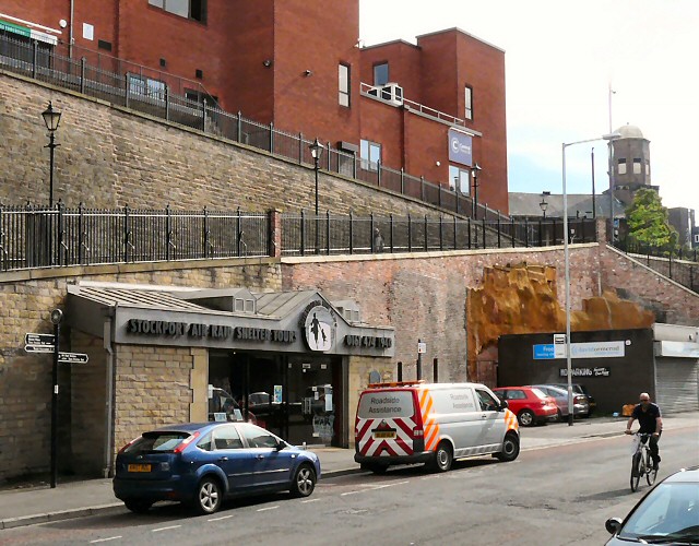Stockport: Things to Do in Manchester's Comeback Town 5 The entrance building of the Stockport Air Raid Shelters set against a sandstone cliff on Chestergate