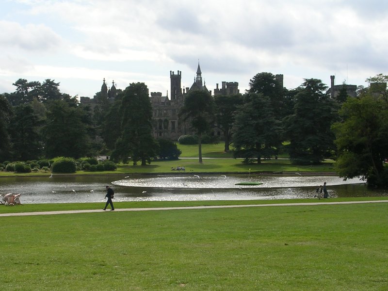 Alton Towers & Theme Parks Near Manchester 2 A lake and lawns at Alton Towers with the turrets of the old house above a line of trees