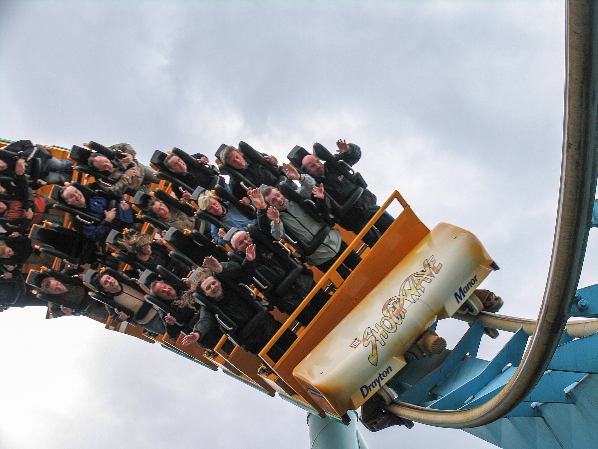 Alton Towers & Theme Parks Near Manchester 6 Riders upside down on a roller coaster train marked Drayton Manor